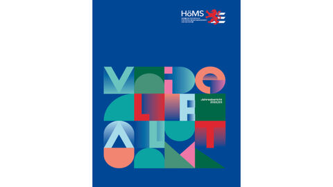 Bild zeigt Titelseite des Jahresberichts, bunte Mosaik auf einfarbigem Hintergrund